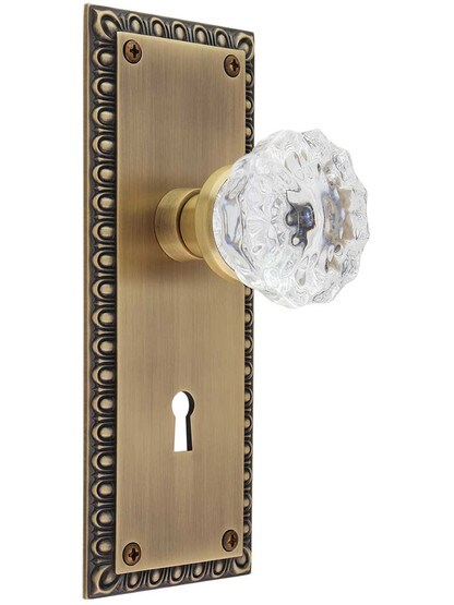 Ovolo Door Set with Fluted Crystal Glass Knobs and Keyhole in Antique Brass.